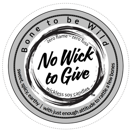 A circular product label for 'No Wick to Give' wickless soy candles with the name Bone to be Wild, shown on a plain white background.