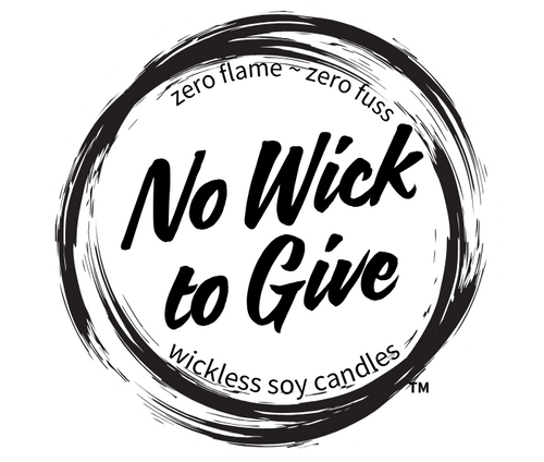 A circular black-and-white logo reading 'No Wick to Give' with smaller text 'zero flame ~ zero fuss' and 'wickless soy candles' on a plain white background.