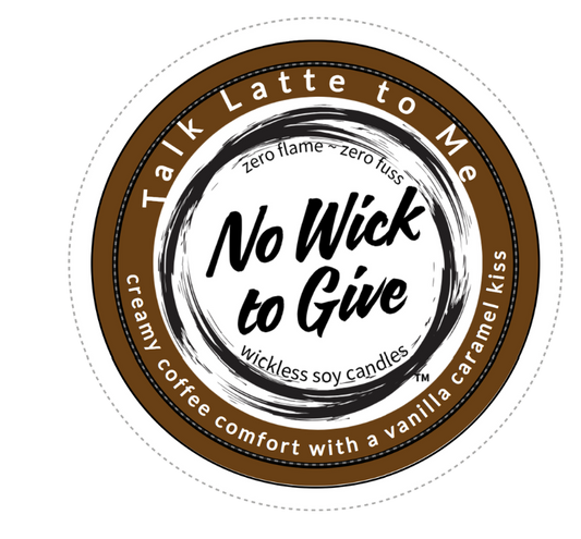 A round wax melt packaging label or sticker for 'No Wick to Give' soy candles, featuring a brown and white design with the scent description 'creamy coffee comfort with a vanilla caramel kiss'.
